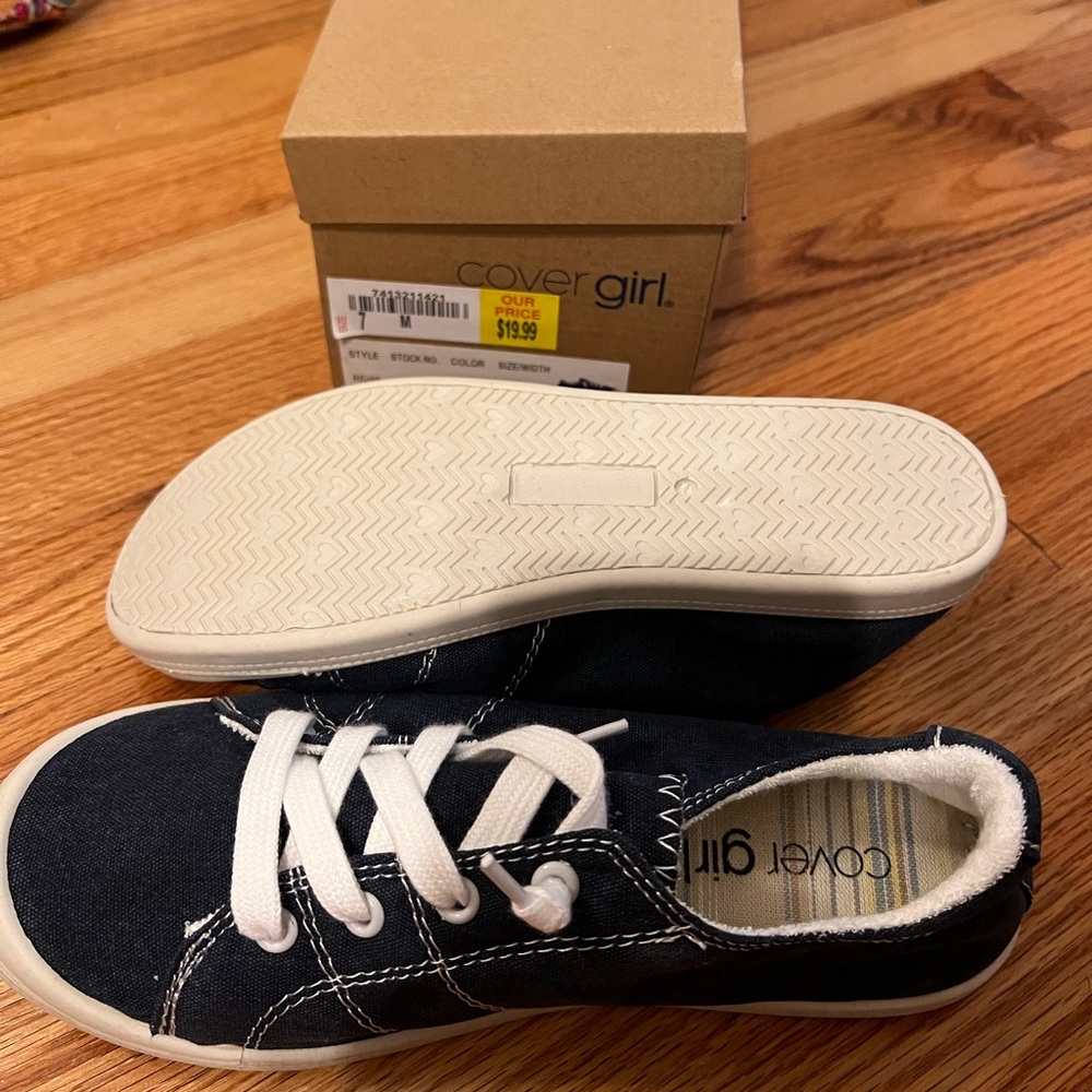 Cover Girl slip on tennis shoes. Never worn. Size 7.